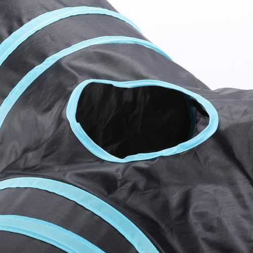 A black and blue Anything Pets Three Tunnel bag with a hole in it.