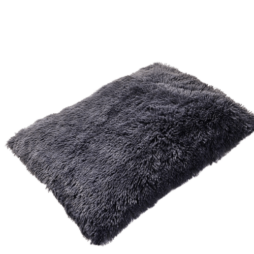 A gray shaggy Anything Pets rug on a white background.