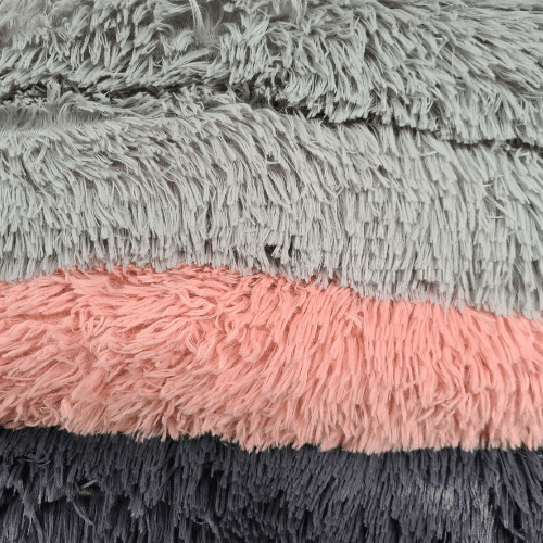 A close up of an Anything Pets Thick Cozy Bed shaggy rug.