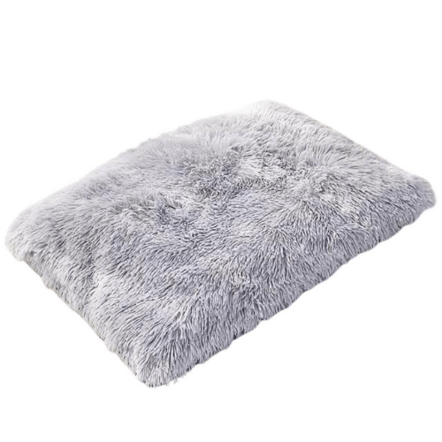 A fluffy gray Anything Pets rug on a white background.